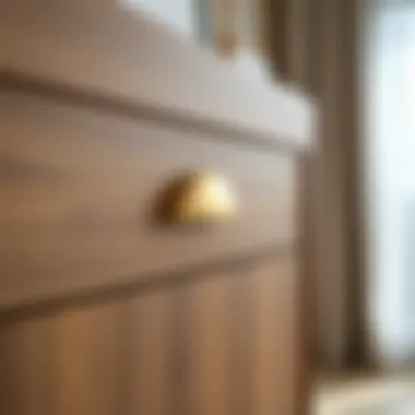 Gold half moon cabinet pull installation on a contemporary dresser