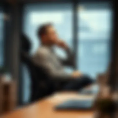 An individual in a thoughtful position, comfortably utilizing an office chair with adjustable armrests.